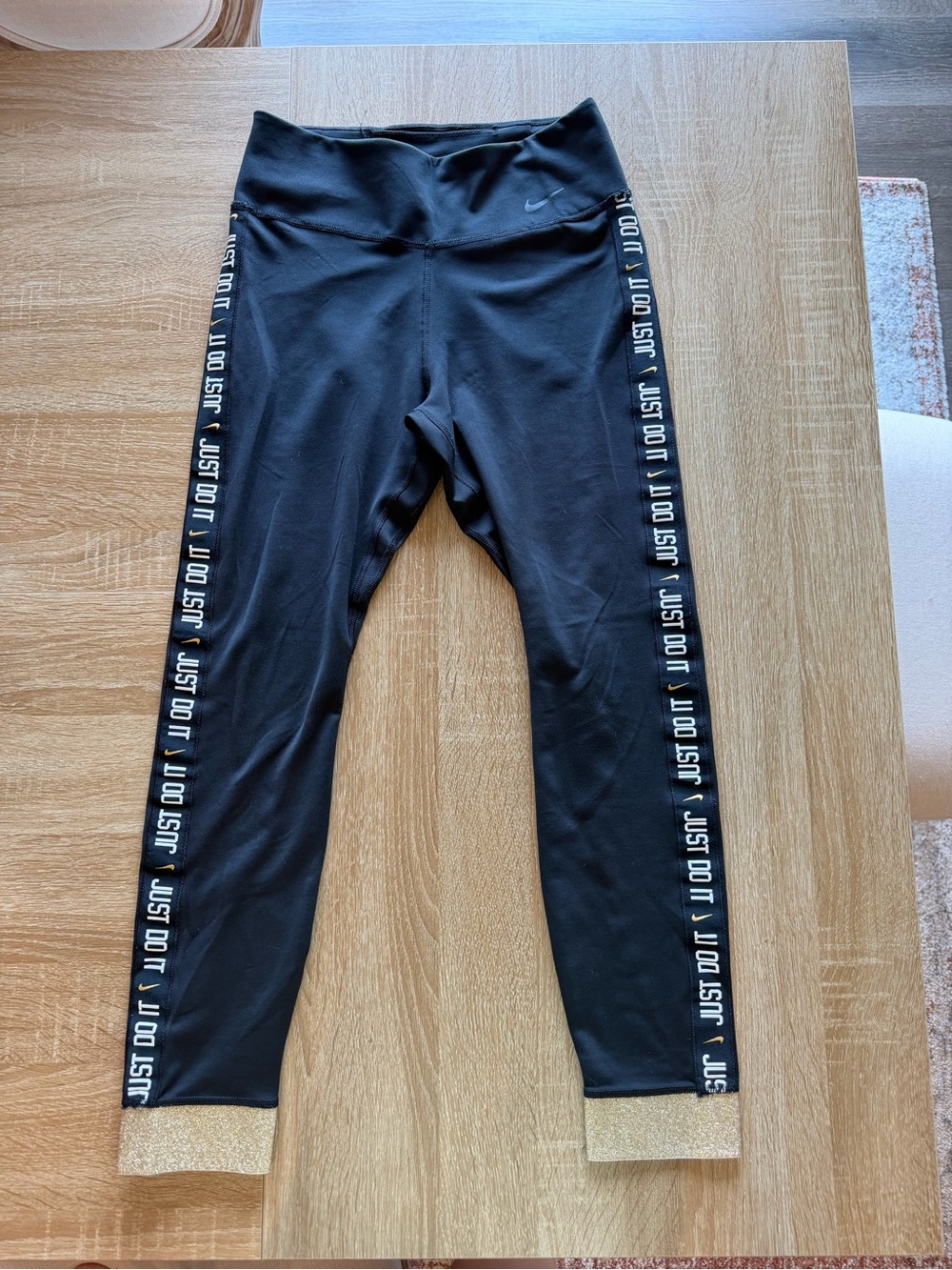 Nike Black Leggings with Gold Hem and 'JUST DO IT' Side Tape